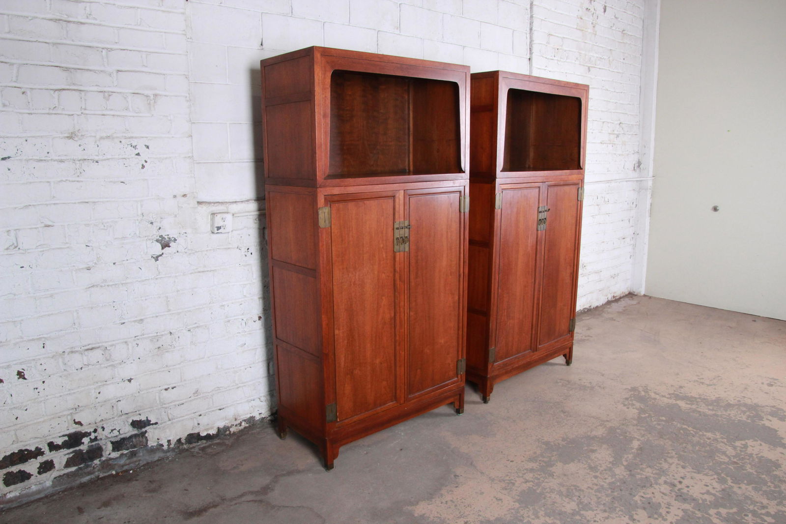 Michael Taylor for Baker Far East Collection Walnut: A gorgeous pair of mid-century modern Hollywood Regency Chinoiserie bookcases or wall units Designed by Michael Taylor for Baker Furniture "Far East" Collection USA 1960s Walnut + brass Measures: 40"W