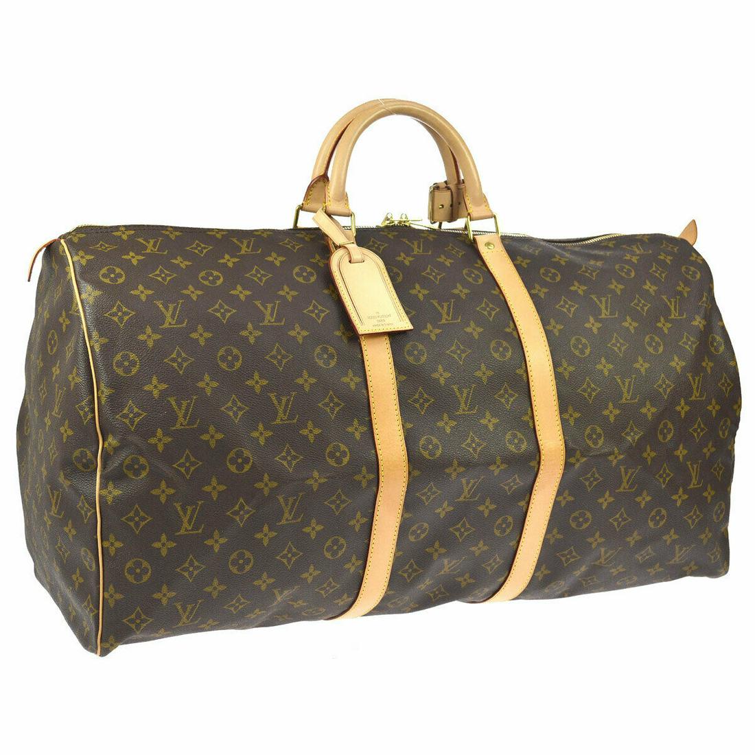 Authentic LOUIS VUITTON Travel Hand Bag: Brand: LOUIS VUITTON Model: Travel Hand Bag Country of Origin: France Material: Monogram Canvas Leather Color: Brown Size (Inch): W 23.2 x H 12.2 x D 10.2 " Handle Drop. 4.3 " Size (CM): W 59.0 x H 31
