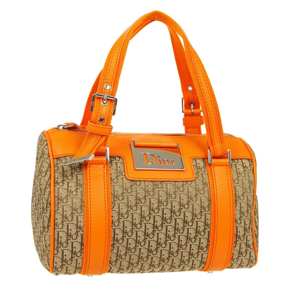 Authentic CHRISTIAN DIOR Hand Bag: Brand: CHRISTIAN DIOR Model: Hand Bag Country of Origin: Italy Material: Nylon Color: Brown Orange Size (Inch): W 9.4 x H 5.9 x D 4.7 " Handle Drop. 4.3 - 5.9 " Size (CM): W 24.0 x H 15.0 x D 12.0 cm 
