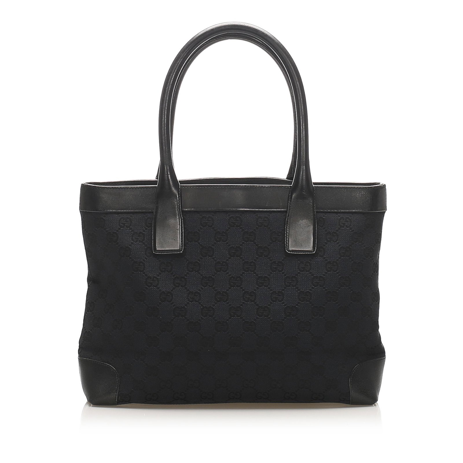 Authentic Gucci GG Canvas Tote Bag: This tote bag features a canvas body with leather trim rolled leather straps an open top with a magnetic snap closure and an interior zip pocket. Brand: Gucci Model: GG Canvas Tote Bag Origin: Italy C