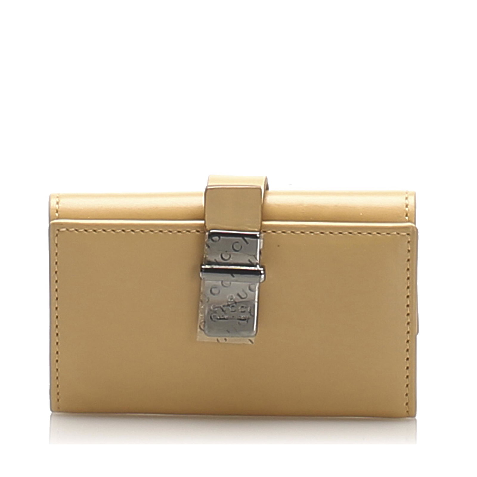 Authentic Gucci Leather Key Holder: This key holder features a leather body a side strap with snap button closure and interior key rings. Brand: Gucci Model: Leather Key Holder Origin: Italy Category: Key Holder Color: Brown x Beige Sty