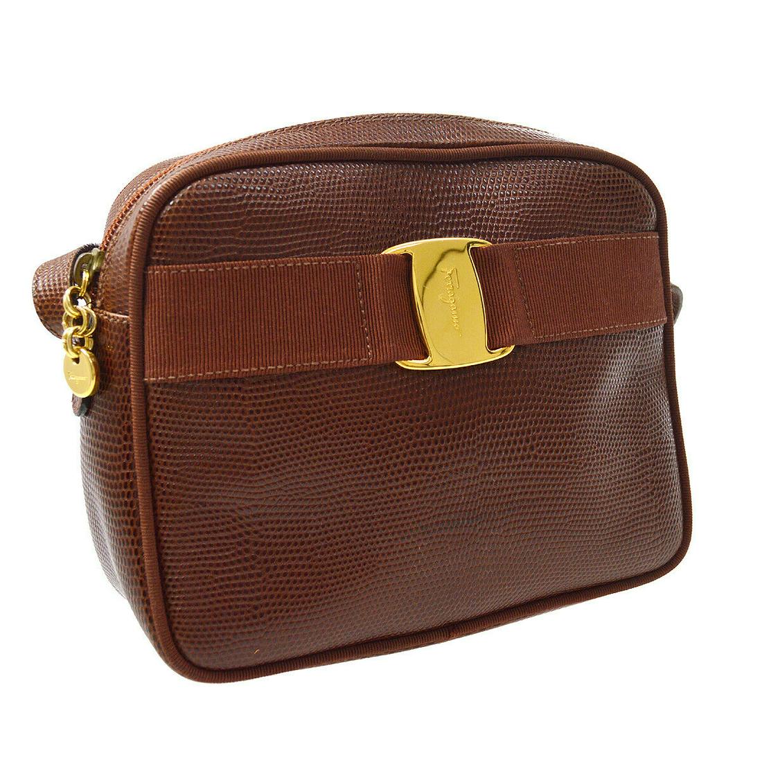 Authentic SALVATORE FERRAGAMO Messenger & Cross Body: Brand: SALVATORE FERRAGAMO Model: Messenger & Cross Body Country of Origin: Italy Material: Canvas Color: Brown Size (Inch): W 7.5 x H 5.9 x D 2.8 "Shoulder Drop. 21.7 " Size (CM): W 19.0 x H 15.0 x D
