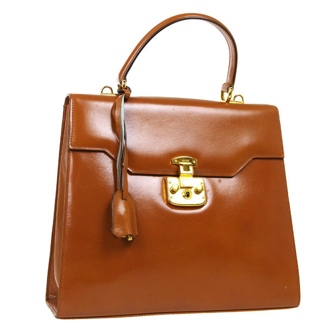 Authentic GUCCI 2Way Hand Bag: Brand: GUCCI Model: 2Way Hand Bag Country of Origin: Italy Material: Leather Color: Brown Size (Inch): W 11.4 x H 9.8 x D 4.3 " Handle Drop. 3.9 " Strap Drop. 17.7 " Size (CM): W 29.0 x H 25.0 x D 11.