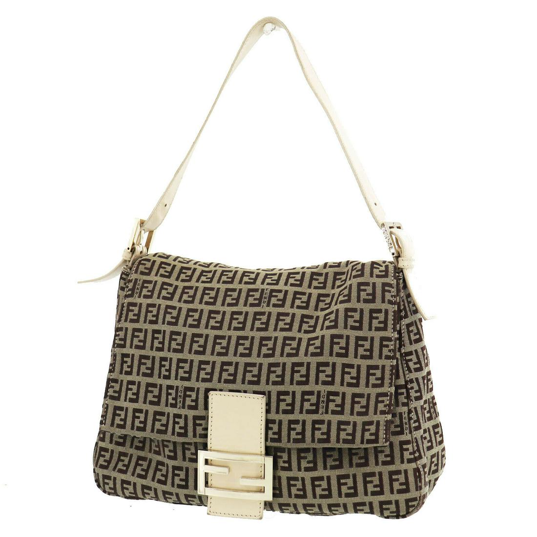 Authentic FENDI Hand Bag: Brand: FENDI Model: Hand Bag Country of Origin: Italy Material: Canvas Color: Gold Bag Length: 11.0 Bag Height: 8.2 Bag Depth: 4.5 All Bidhaus items come with a 100 % money-back authenticity guarantee