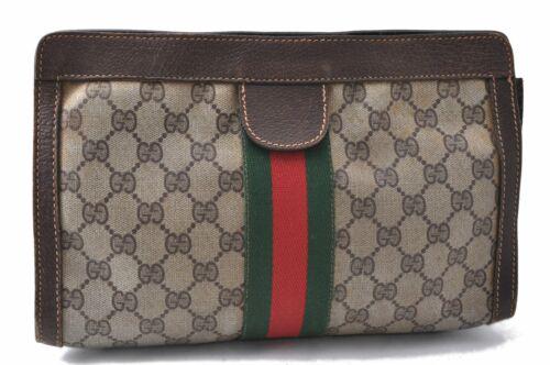 Authentic GUCCI Clutch Bag: Brand: GUCCI Model: Clutch Bag Country of Origin: Italy Material: PVC Color: Brown Bag Length: 10.8inches(27.5cm) Bag Height: 6.5inches(16.5cm) Bag Depth: 2.6inches(6.5cm) All Bidhaus items come with 