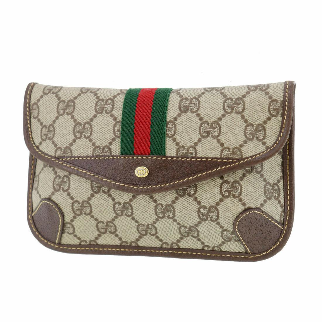 Authentic GUCCI Pouch: Brand: GUCCI Model: Pouch Country of Origin: Italy Material: Canvas Color: Gold Bag Length: 7.6 Bag Height: 5.1 Bag Depth: 0.5 All Bidhaus items come with a 100 % money-back authenticity guarantee. AL