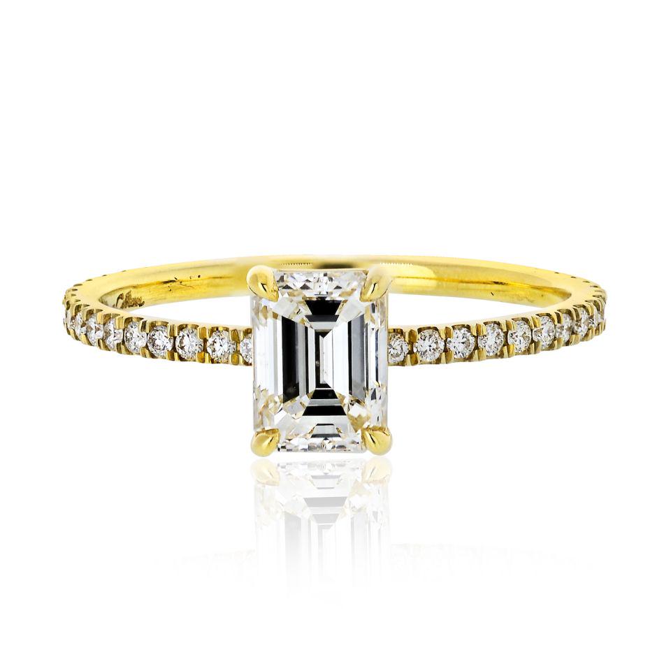 0.95 carat Emerald Cut Diamond G/SI1 GIA Engagement: Type: Engagement Rings Metal: 18K Yellow Gold Grams: 1.8 Exact Diamond Weight: 0.95 Cts Measurements: Size 6.5 Condition: Excellent. Signed By: Julius cohen Other Details: Containing one bright and be