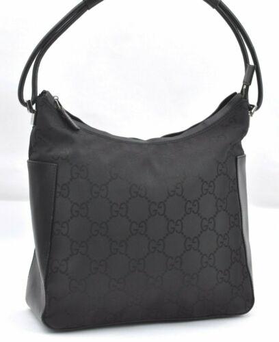 Authentic GUCCI Hand Bag: Brand: GUCCI Model: Hand Bag Country of Origin: Italy Material: Nylon Color: Black Bag Length: 10inches (25.5cm) Bag Height: 9.4inches (24cm) Bag Depth: 3.7inches (9.5cm) All Bidhaus items come with a