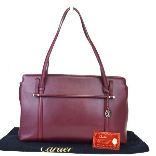 Authentic Must De Cartier 2C Tote Shoulder Bag Leather: Size: Medium Brand: CARTIER Style: Shoulder Bag Bag Depth: 4.3 Bag Height: 9.1 Bag Width: 13.8 Color: Bordeaux All Bidhaus items come with a 100% money-back authenticity guarantee. ALL SALES ARE FINAL
