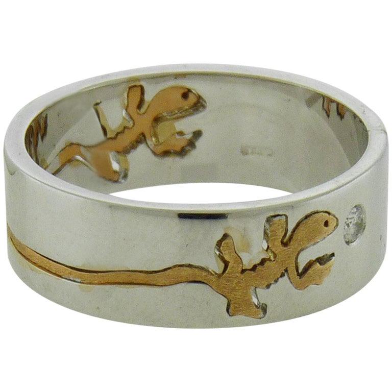 Authentic Crivelli 18 Karat Gold Diamond Salamander: A Crivelli 18k Gold Diamond Salamander Ring accented with two diamonds approximately 0.07 carats. Retail price: $2 850 Total weight: 8.4 grams Size: 8.5 All Bidhaus items come with a 100% money-back a