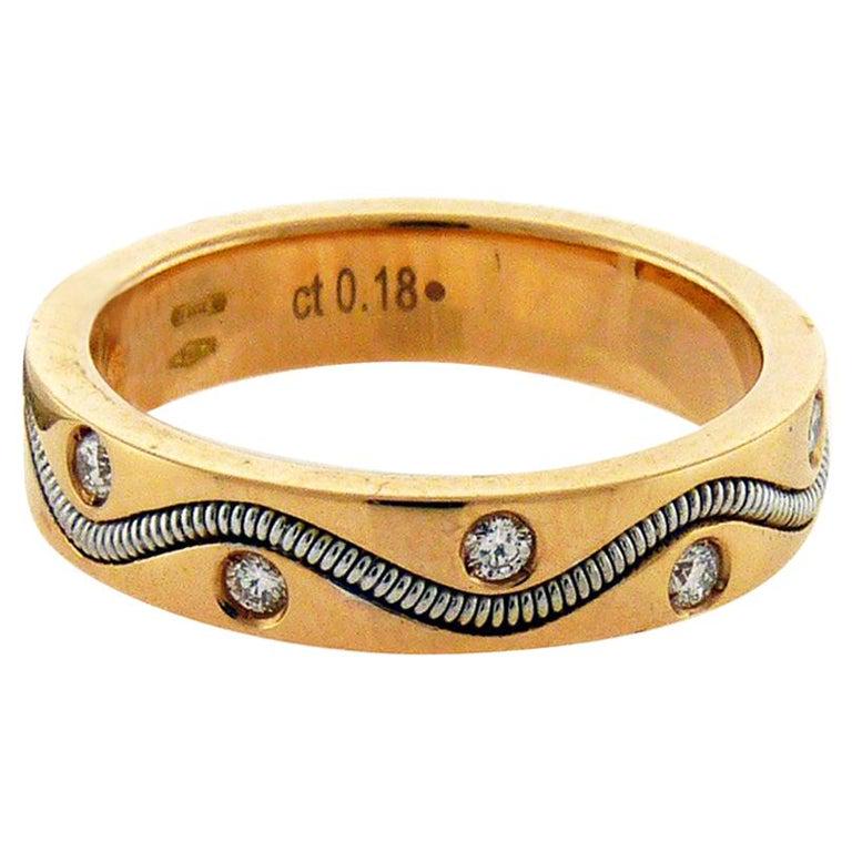 Authentic Crivelli 18 Karat Gold Diamond Ring: Crivelli 18K gold diamond ring with a cool spiral design accented with nine diamonds. Retail price: $2 470 Diamonds: 0.18 carat Available in sizes: 6 6.5 Weight: 6.1 grams All Bidhaus items come with