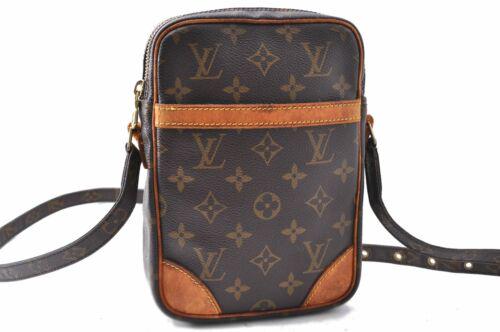 Authentic Louis Vuitton Monogram Danube Shoulder Bag: Brand: Louis Vuitton Bag Height: 8.5inches (21.5cm) Material: Monogram Canvas Bag Depth: 1.8inches (4.5cm) Style: Shoulder Bag MPN: Does not apply Color: Brown Serial Number: AR1020 Department: Women 