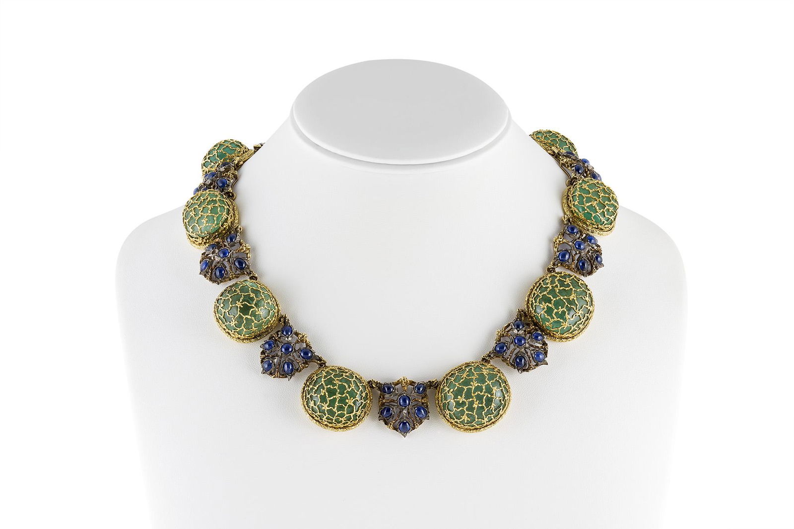 Authentic Buccellati Emeralds and Sapphire Necklace: Signed by Buccellati Necklace finely crafted in sliver on top of 18k yellow gold with sapphires and green emeralds. All Bidhaus items come with a 100% money-back authenticity guarantee. ALL SALES ARE