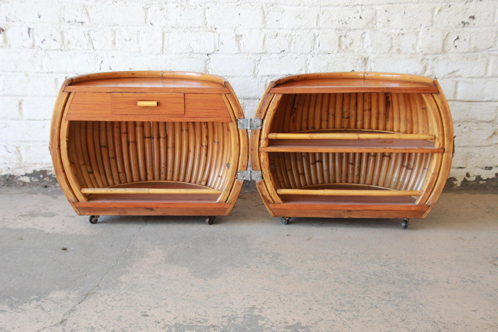 Vintage Mid-Century Modern Bamboo Dry Bar End Table: Offering a very unique bamboo dry bar end table circa 1960s. The side table has a great unique style that open up to a dry bar. The left side features a small drawer for storage and space for your ite