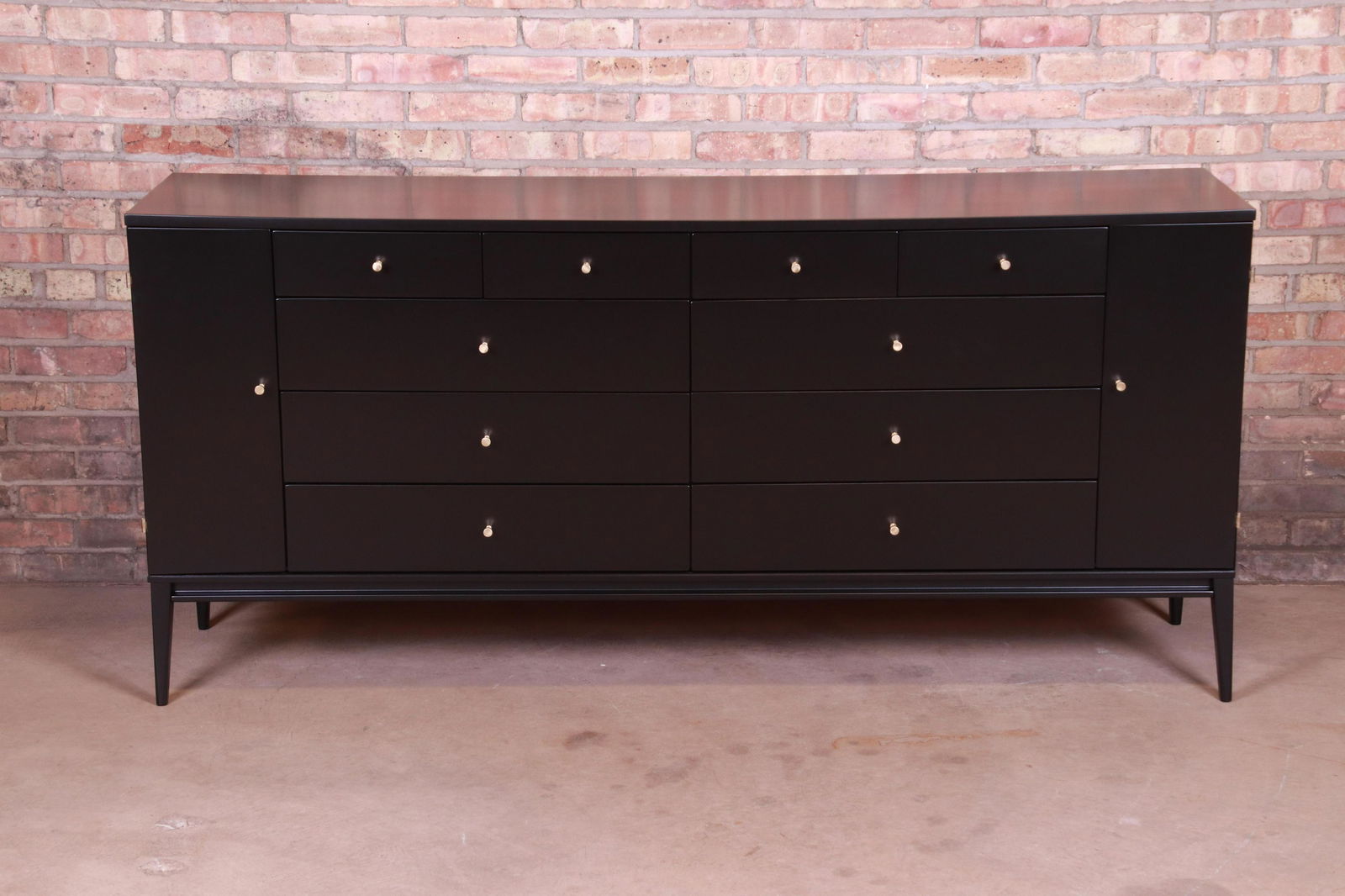 Paul McCobb Planner Group Black Lacquered 20-Drawer: A rare and exceptional mid-century modern 20-drawer dresser or credenza By Paul McCobb for Winchendon Furniture "Planner Group" USA 1950s Black lacquered solid birch with original brass hardware. Meas