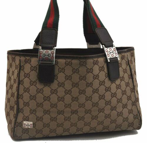 Authentic GUCCI Web Sherry Line Hand Bag GG Canvas: Brand: GUCCI Style: Hand Bag Country/Region of Manufacture: Italy Type: Hand Bag Serial Number: 145810002122 Department: Women Bag Length: 11.8inches (30cm) Material: Canvas Bag Height: 7.5inches (19c