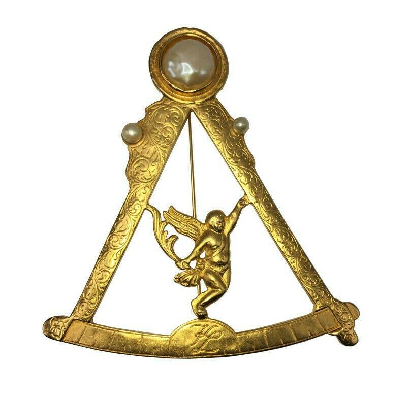 Massive Karl Lagerfeld Monogram Gold Tone Pearl Compass: Massive Karl Lagerfeld Monogram Gold Tone Pearl Compass with Angel Circa 1980s. Measures 4" tall by 3 1/2" wide. Features large baroque simulated pearl cabochon that measures 11 mm's diameter. Marked 