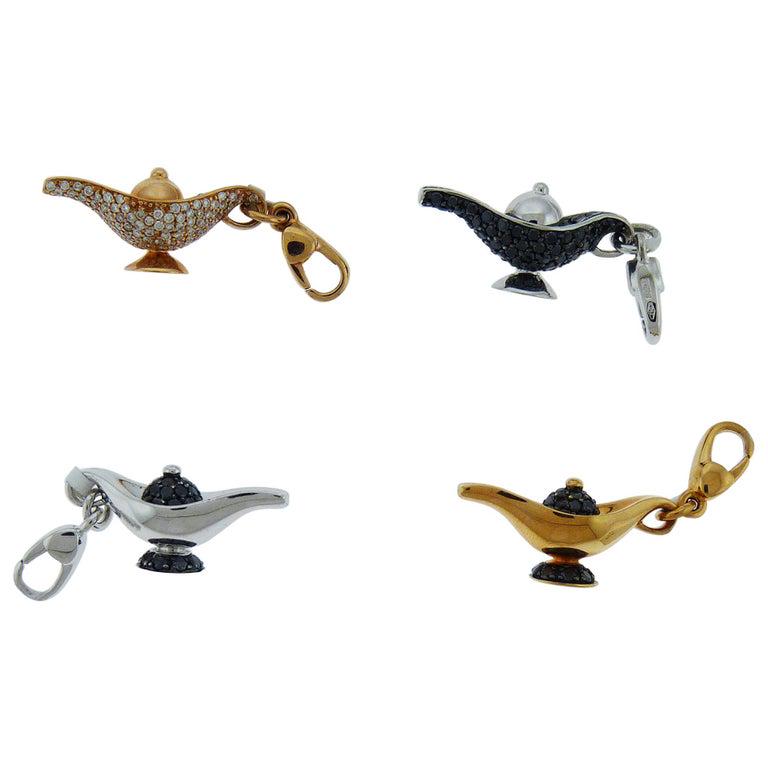 Authentic Diamond and 18 Karat Gold Lamp Charms by: Bracelet lamp charms embellished with diamonds and set in 18K gold. Made in Italy by Crivelli. Available in 18K yellow gold with white or black diamonds. Or in white gold with black diamonds. The leng