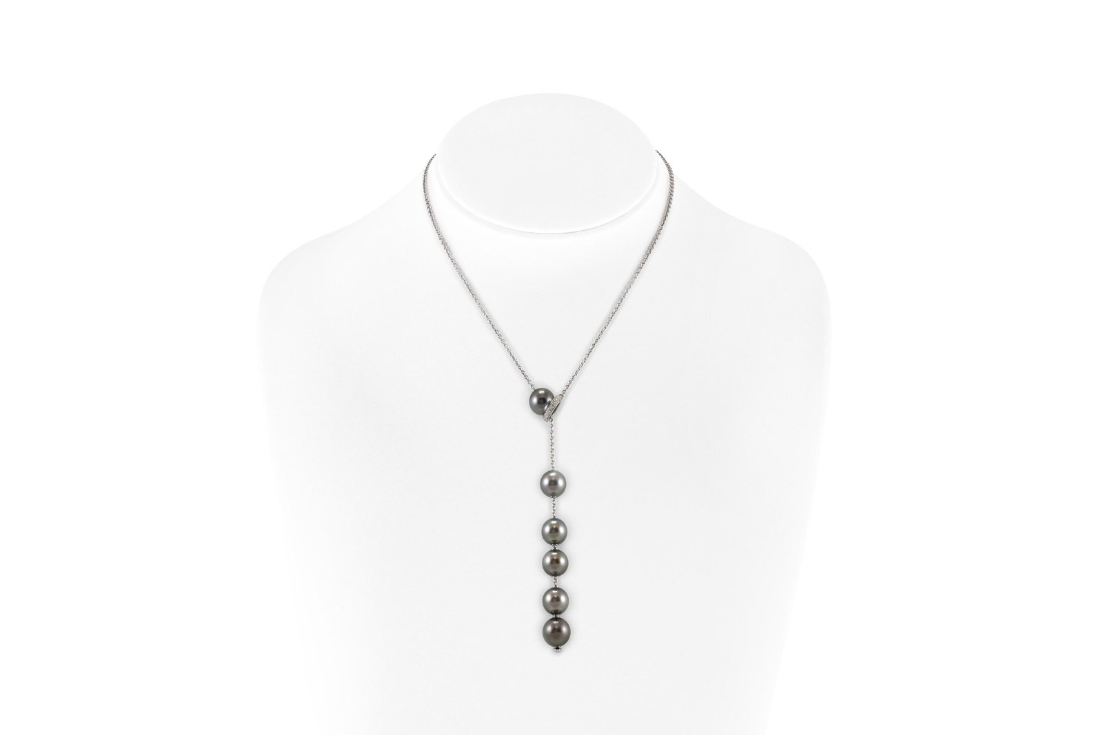 Authentic Mikomoto Tahitian Pearls Necklace with: Finely crafted in 18k white gold and 6 Tahitian Pearls.The necklace features diamonds of VVS1 clarity weighing approximately a total of 0.20 carats.Signed by Mikimoto All Bidhaus items come with a 100