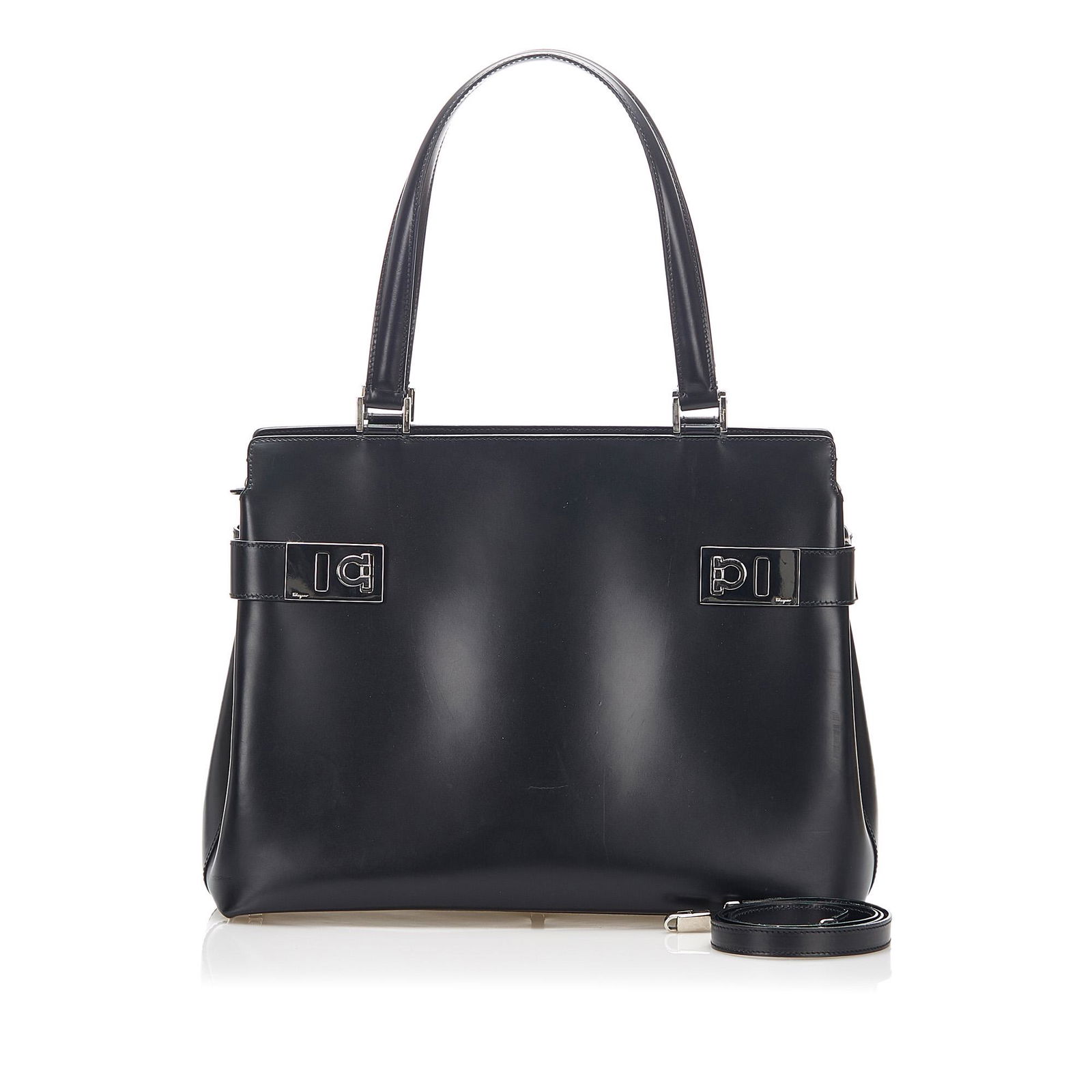 Authentic Ferragamo Gancini Leather Satchel: This satchel features a leather body rolled leather handles a flat leather strap an open top an interior zip compartment and interior zip and slip pockets. Brand: Ferragamo Model: Gancini Leather Satc