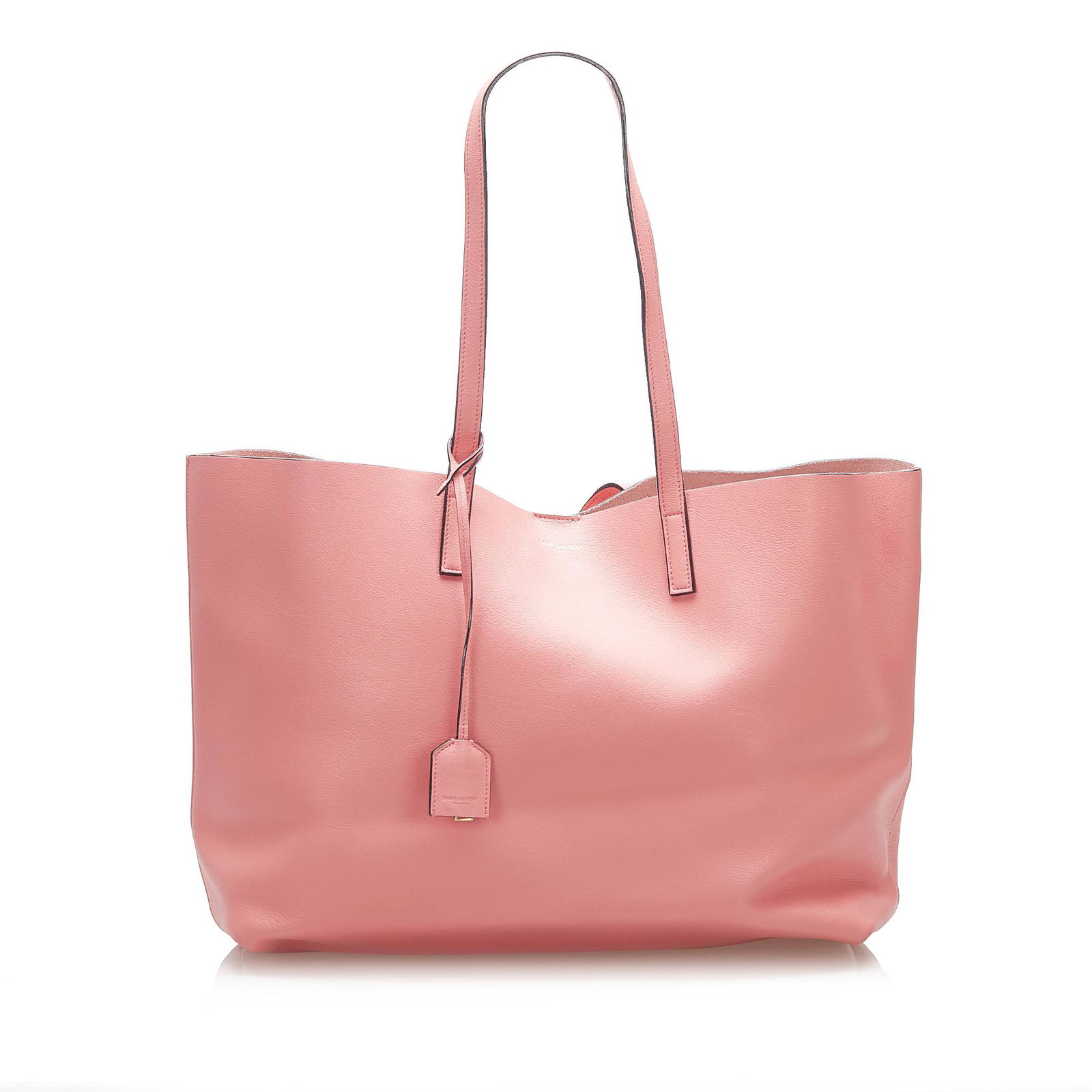 Authentic YSL EastWest Leather Tote Bag: The EastWest Tote features a leather body a flat leather straps a top magnetic closure and an interior zip pouch. Brand: YSL Model: EastWest Leather Tote Bag Origin: France Category: Bags Color: Pink