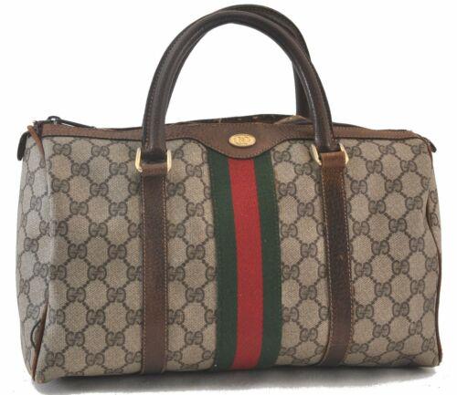 Authentic GUCCI Web Sherry Line Hand Boston Bag GG PVC: Brand: GUCCI Type: Hand Bag Bag Length: 13inches (33cm) Department: Women Bag Height: 7.3inches (18.5cm) Material: PVC Bag Depth: 5.9inches (15cm) Color: Brown Handle Drop: 3.9inches (10cm) MPN: Does 