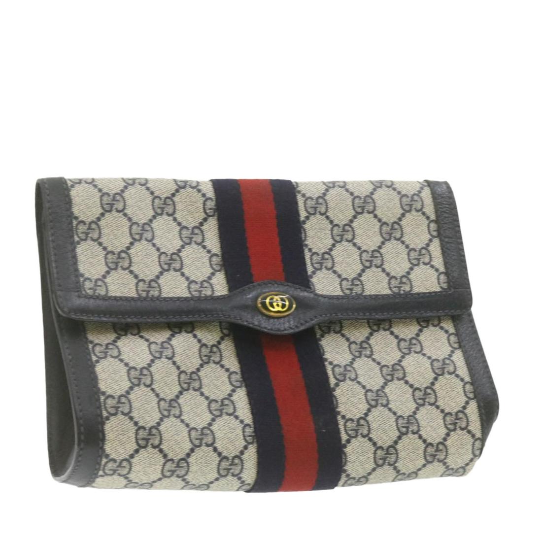 Authentic GUCCI Sherry Line GG Canvas Clutch Bag Navy: Brand: GUCCI Style: Clutch Bag Material: PVC Leather Color: Blue Made In: Italy Size (Inches): W9.84 x H5.9 x D2.75inch(Approx) Exterior Condition: PVC Leather : slightly rubbing lose shape Leather : 