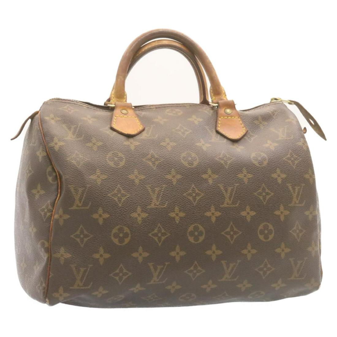 Authentic LOUIS VUITTON Monogram Speedy 30 Hand Bag: Brand: LOUIS VUITTON Style: Hand Bag Material: Monogram Canvas Color: Monogram Made In: France Size (Inches): W12 x H9 x D6.5"(Approx) Exterior Condition: Monogram Canvas : lose shape rubbing crack Le
