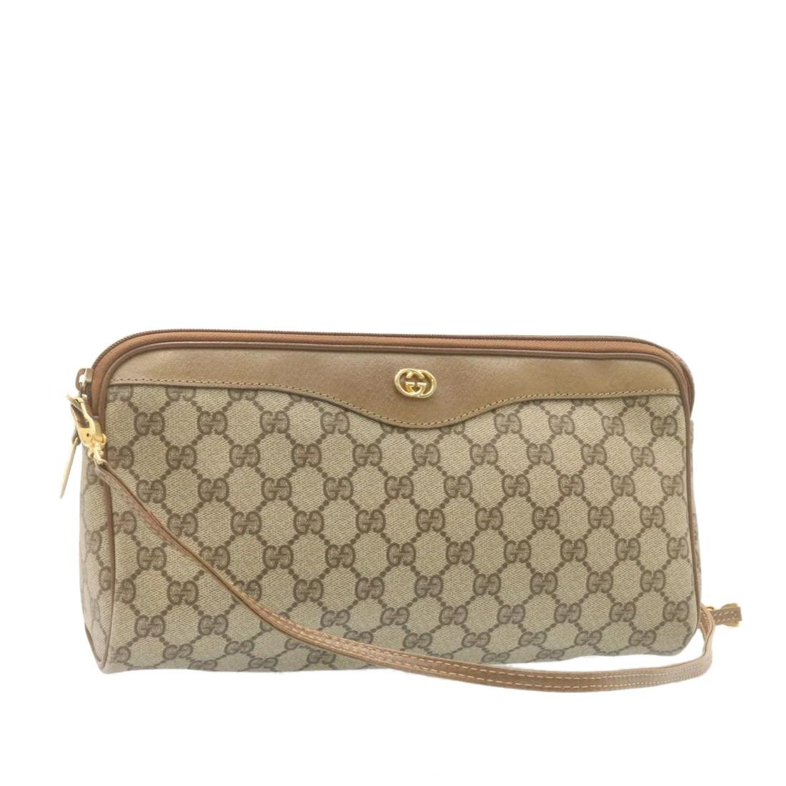 Authentic GUCCI GG Canvas 2Way Shoulder Clutch Bag: Brand: GUCCI Style: Clutch Bag Material: PVC Leather Color: Beige Made In: Italy Size (Inches): W11.81 x H6.69 x D2.36inch / Shoulder Drop 22.83inch(Approx) Exterior Condition: PVC Leather : slightly 
