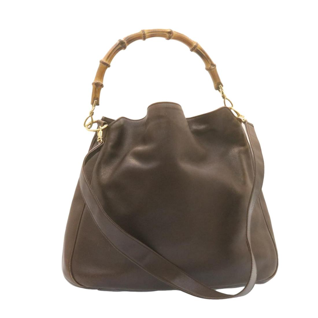 Authentic GUCCI Bamboo 2Way Shoulder Bag Brown Leather: Brand: GUCCI Style: Shoulder Bag Material: Leather Color: Brown Made In: France Size (Inches): W15.74 x H12.99 x D4.33inch / Shoulder Drop 7.08-17.71inch(Approx) Exterior Condition: Nylon : lose shape