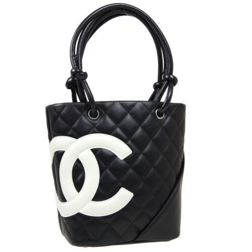 Authentic CHANEL Quilted Cambon Line CC Hand Tote Bag: Size: Medium Features: Hand Tooled Bottom Studs Accents: Studs Quilted Color: Black White Model: Hand Tote Bag MPN: Does Not Apply Country/Region of Manufacture: Italy Closure: Open Style: Tote Occasi