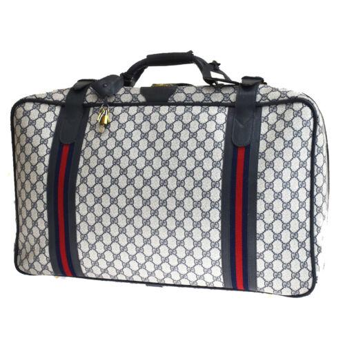 Authentic GUCCI Shelly GG Pattern Travel Hand Bag PVC: Size: Extra Large Color: Navy Blue Country/Region of Manufacture: Italy Closure: Zip Department: Women Hardware Material: Gold-Plated Style: Hand Bag Occasion: Casual Travel Handle Style: Top Handle B