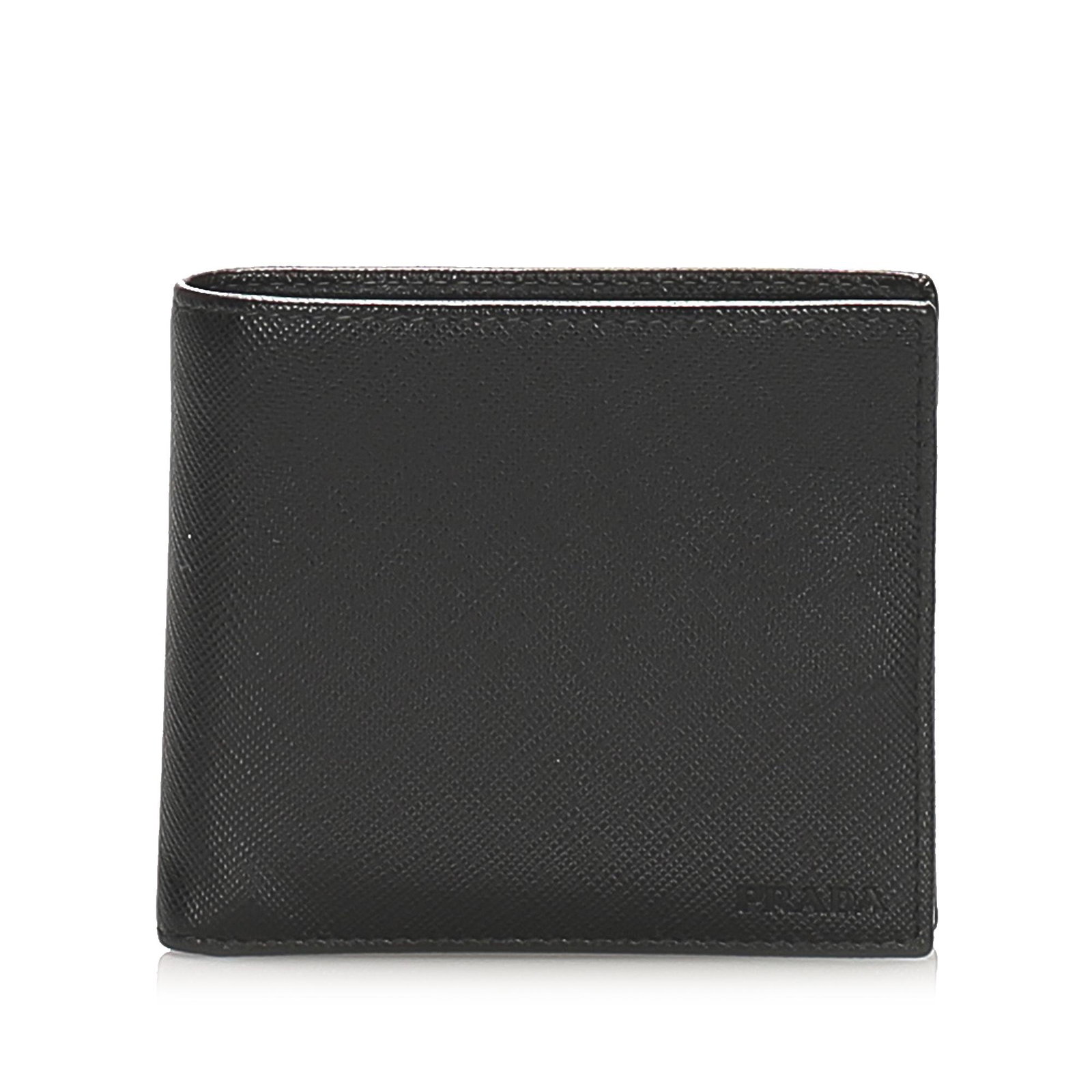 Authentic Prada Saffiano Bifold Wallet: This item qualifies for FREE DOMESTIC SHIPPING to customers in the USA This small wallet features a saffiano leather body and an interior slip pockets. Brand: Prada Model: Saffiano Bifold Wallet Origi