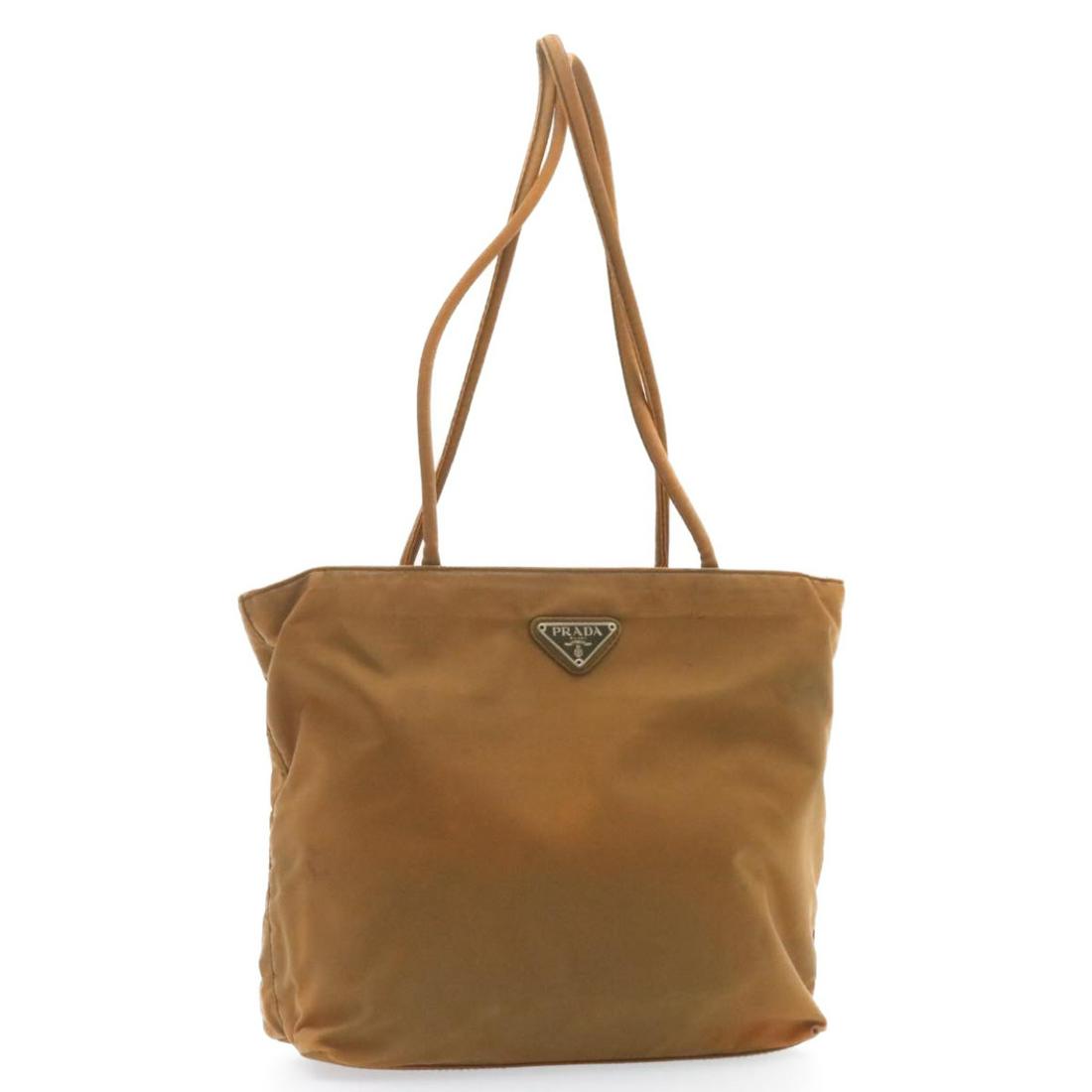 Authentic PRADA Nylon Tote Bag Brown: This item qualifies for FREE DOMESTIC SHIPPING to customers in the USA Brand: PRADA Style: Tote Bag Material: Nylon Color: Brown Made In: Italy Size (Inches): W9.05 x H8.66 x D2.75inch(Approx) Exterio