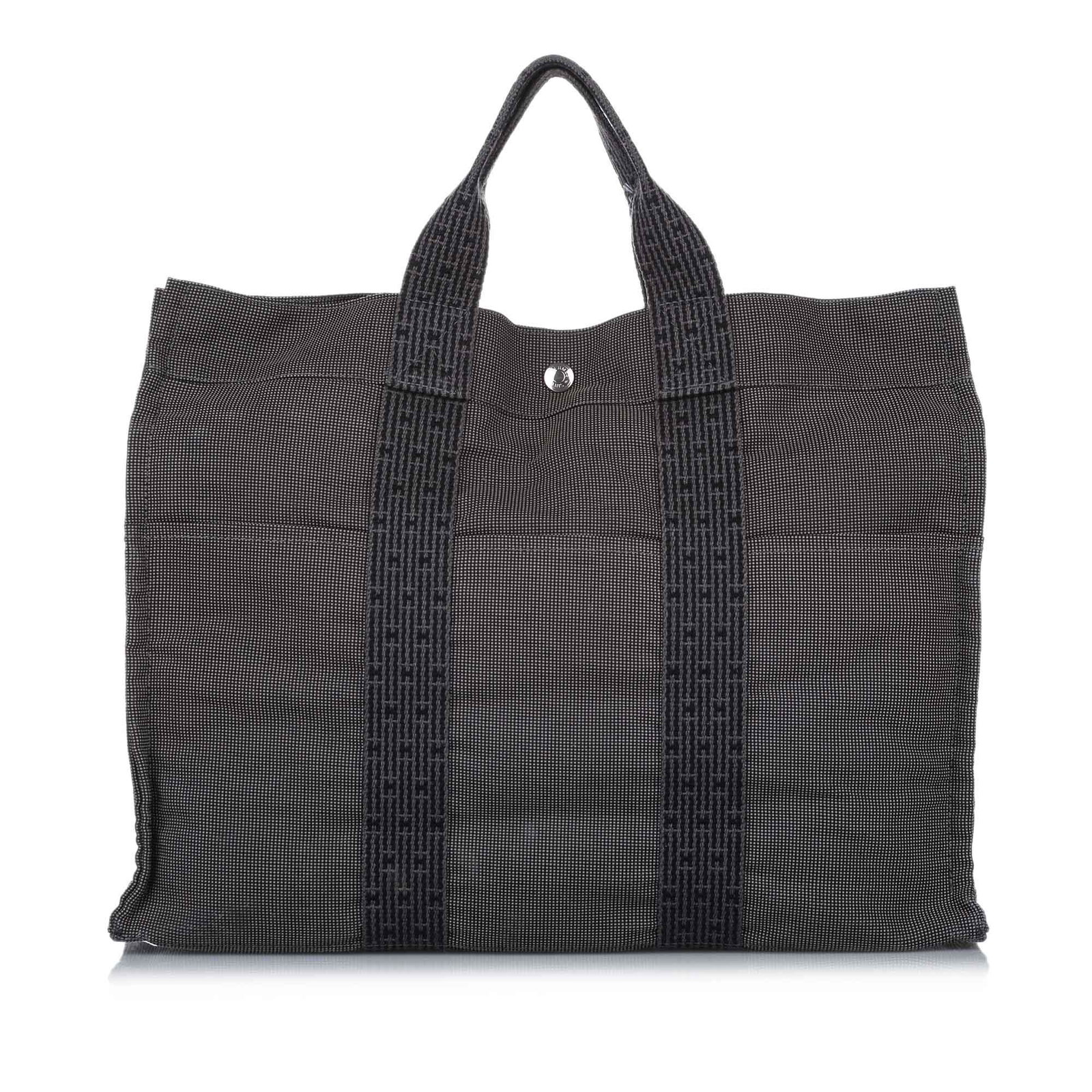 Authentic Hermes Fourre Tout MM: This item qualifies for FREE DOMESTIC SHIPPING to customers in the USA The Fourre Tout MM tote features a canvas body exterior front and back slip pockets flat handles an open top with a snap closure 