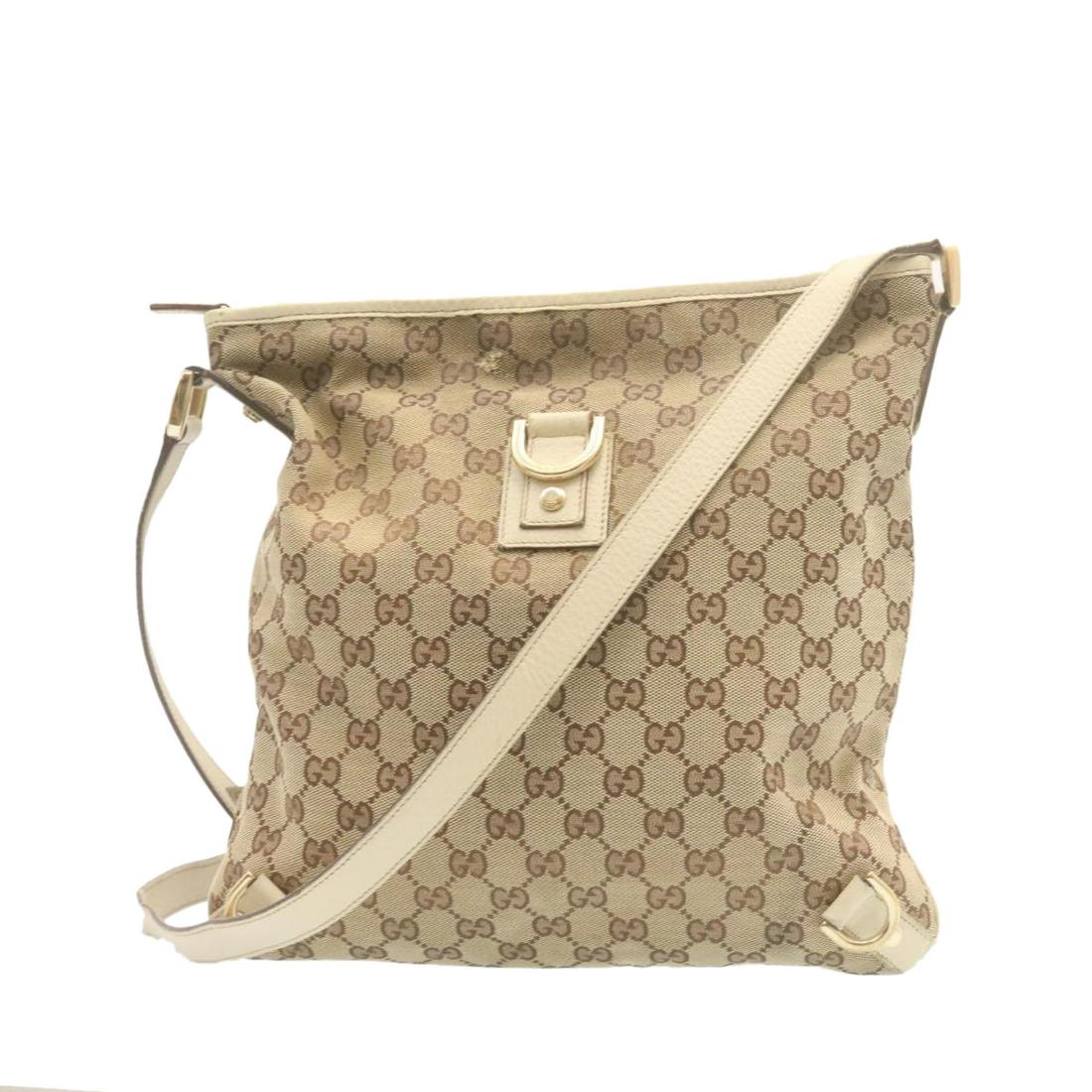 Authentic GUCCI GG Canvas Cross Body Shoulder Bag Beige: This item qualifies for FREE DOMESTIC SHIPPING to customers in the USA Brand: GUCCI Style: Shoulder Bag Material: Canvas Color: Beige Made In: Italy Size (Inches): W11.81 x H11.81 x D1.18inch / Should