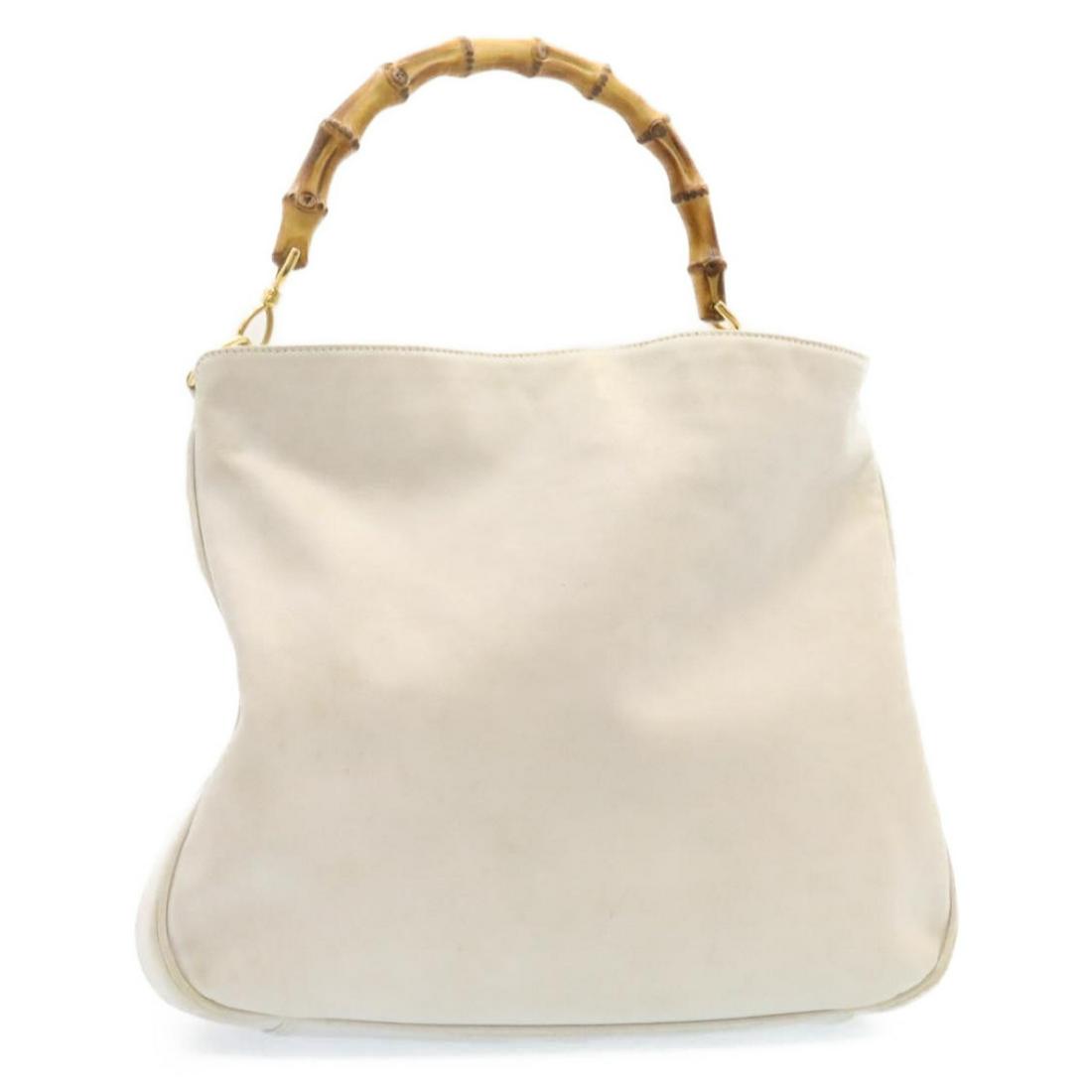 Authentic GUCCI Bamboo Shoulder Bag White Leather: This item qualifies for FREE DOMESTIC SHIPPING to customers in the USA Brand: GUCCI Style: Shoulder Bag Material: Leather Color: White Made In: Italy Size (Inches): W15.74 x H12.99 x D3.93inch(Approx)