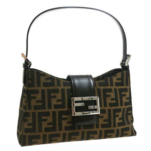 Authentic FENDI Zucca Pattern Mamma Baguette Hand Bag: This item qualifies for FREE DOMESTIC SHIPPING to customers in the USA Size: Medium Pattern: Zucca Accents: Logo Features: Adjustable Strap Inner Pockets Model: Zucca Color: Brown Country/Region of Ma
