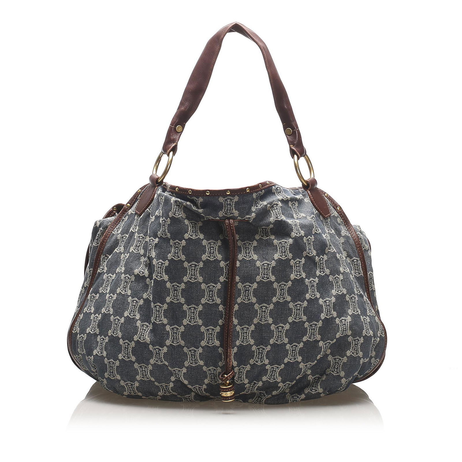 Authentic Celine Triomphe Denim Handbag: This item qualifies for FREE DOMESTIC SHIPPING to customers in the USA This handbag features a denim body with leather trim flat leather straps an open top with magnetic closure and interior zip and s