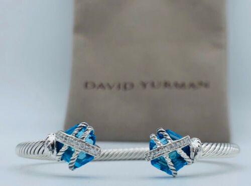 Authentic David Yurman Sterling Silver 10'mm Blue Topaz: This item qualifies for FREE DOMESTIC SHIPPING to customers in the USA Secondary Stone: Topaz Main Stone: Topaz Main Stone Color: Blue Main Stone Creation: Natural Gender: Female Metal: Sterling Silve