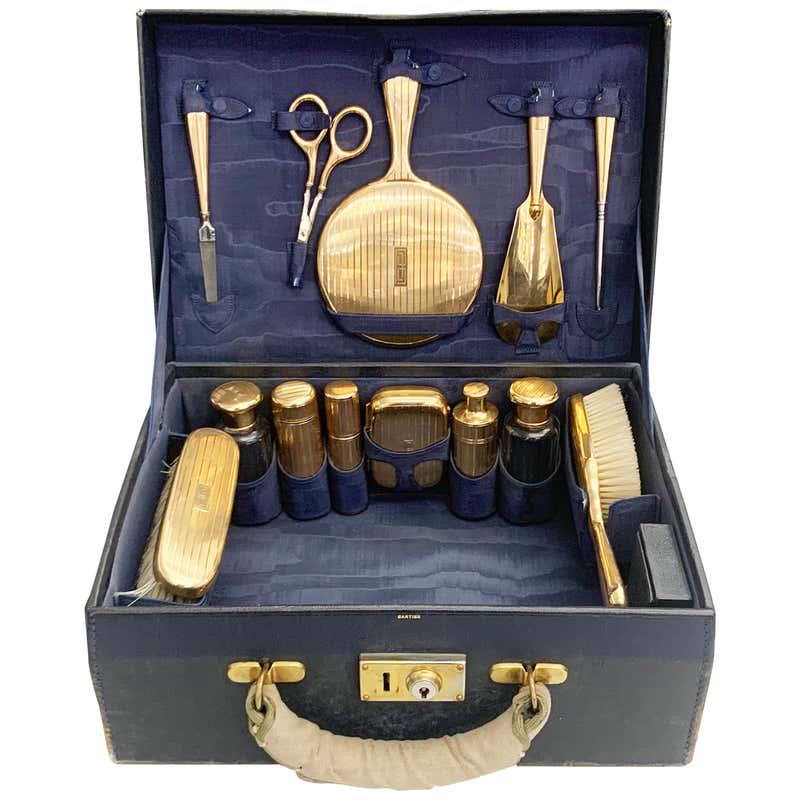 Authentic Cartier Antique Vanity Set in 14 Karat Gold: This item qualifies for FREE DOMESTIC SHIPPING to customers in the USA A wonderfully rare antique 14K gold dresser set contains 18 pieces including: 1 hair brush 1 hair comb 1 clothes brush 3 round go
