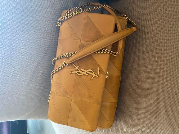 Authentic YSL Jamie Leather Shoulder Bag: This item qualifies for FREE DOMESTIC SHIPPING to customers in the USA The Jamie features a quilted lambskin leather body with suede trim a chain strap a top flap with magnetic snap button closure and