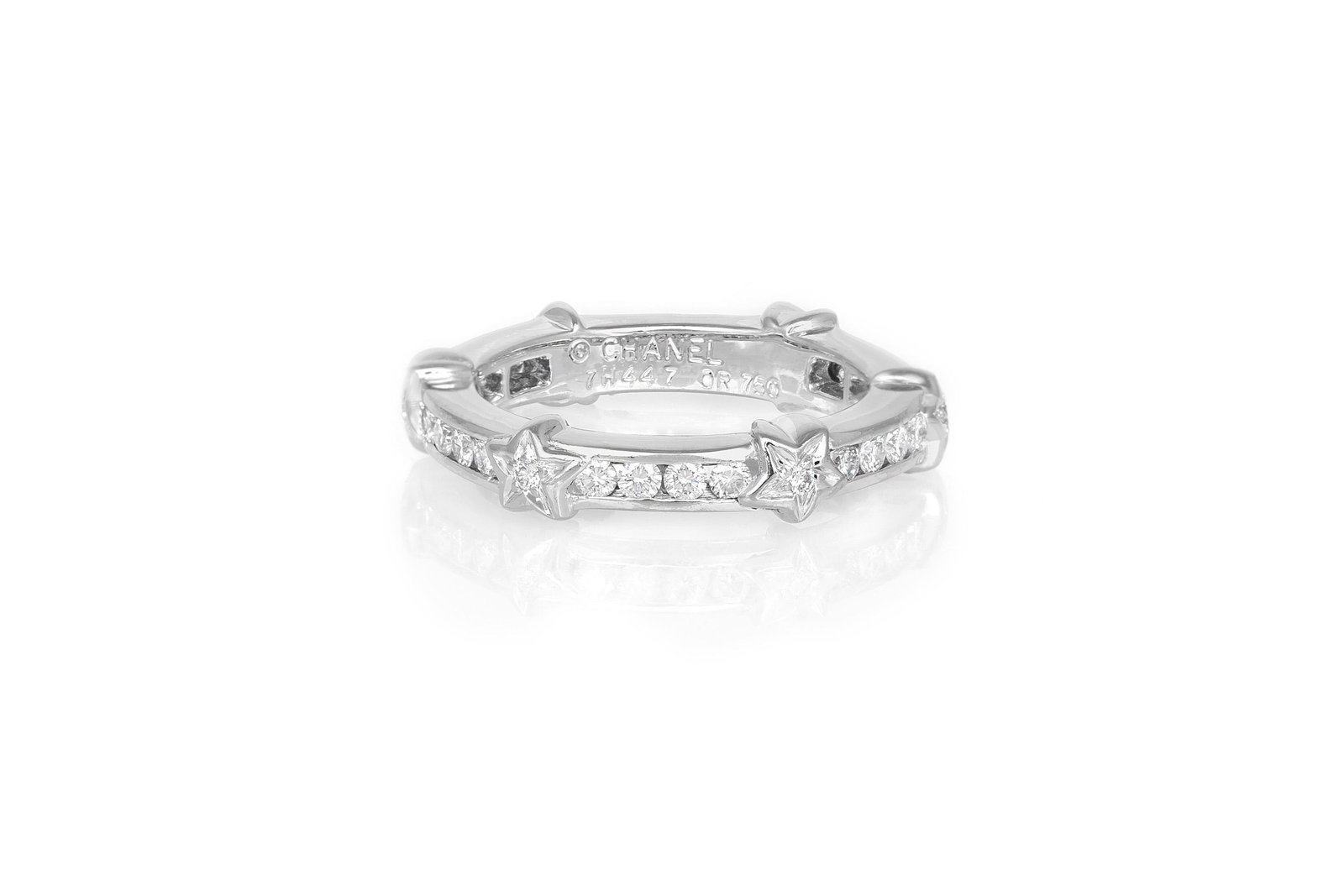 Authentic Chanel Diamond Star Eternity Band: This item qualifies for FREE DOMESTIC SHIPPING to customers in the USA Signed Chanel 18K white gold band ring designed as round-cut diamond-set eternity band with six star motifs each centering a roun