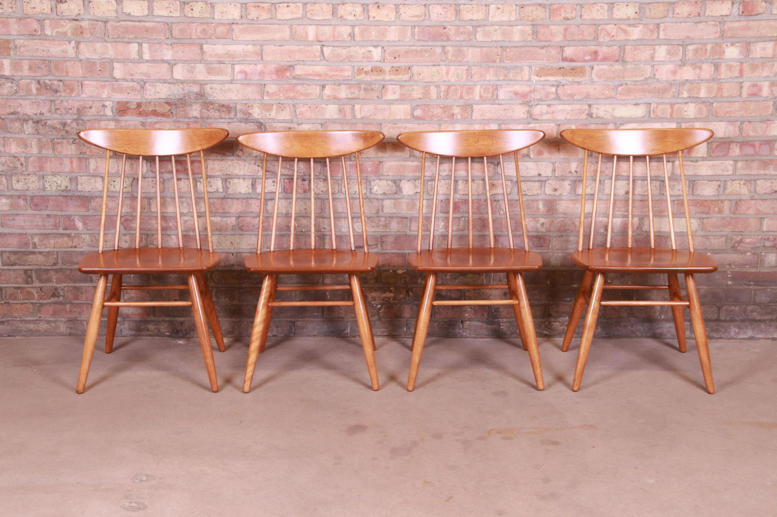 Russel Wright for Conant Ball Solid Birch Dining Chairs: Please see Disclaimer for shipping cost estimates. An exceptional set of four mid-century modern solid birch spindle back dining chairs By Russel Wright for Conant Ball USA 1950s Measures: 20.5"W x 19