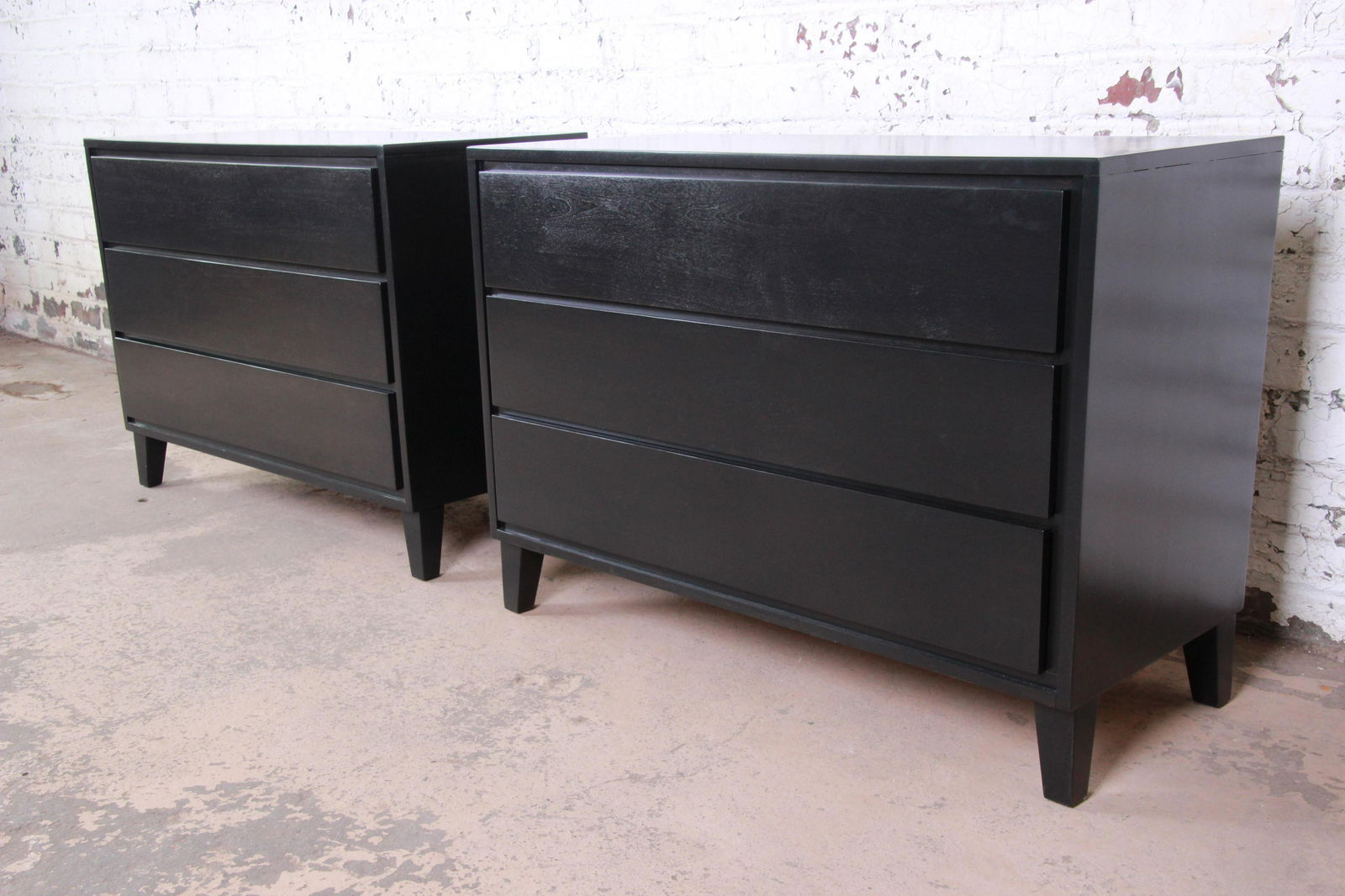 Russel Wright for Conant Ball American Modern Ebonized: Please see Disclaimer for shipping cost estimates. An exceptional pair of ebonized three-drawer dressers or bedside chests designed by Russel Wright for his American Modern line for Conant Ball. The c