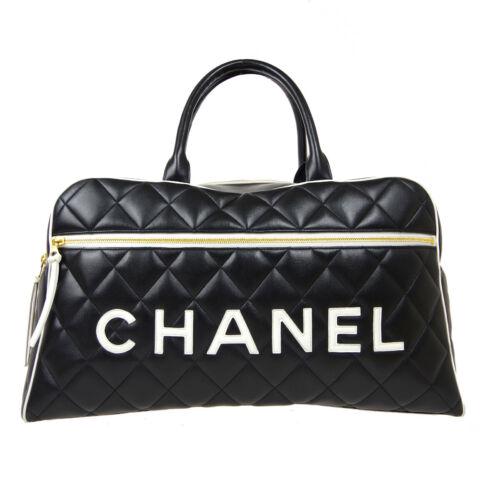Authentic CHANEL Quilted Boston Hand Bag: This item qualifies for FREE DOMESTIC SHIPPING to customers in the USA Size: Large Features: Bottom Studs Inner Pockets Accents: Studs Quilted Color: Black White Model: Hand Bag MPN: Does Not Apply Co