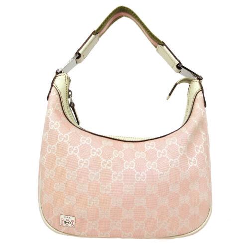 Authentic GUCCI GG Pattern Hand Bag: This item qualifies for FREE DOMESTIC SHIPPING to customers in the USA Size: Medium Material: Canvas Leather Accents: Logo Pattern: GG Model: Hand Bag Features: Inner Pockets Country/Region of Manufac