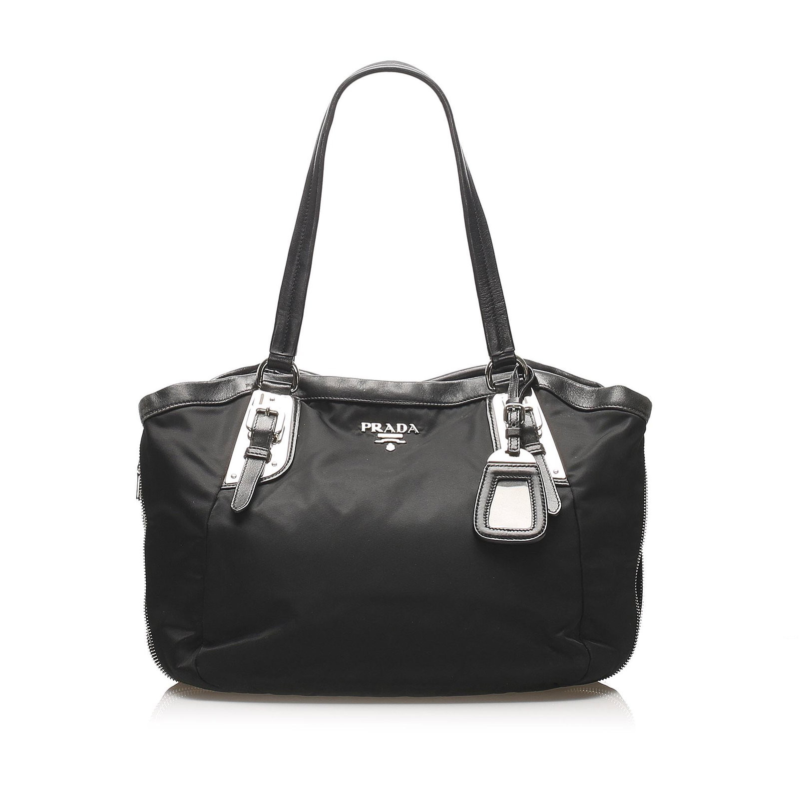 Authentic Prada Tessuto Shoulder Bag: This item qualifies for FREE DOMESTIC SHIPPING to customers in the USA This shoulder bag features a nylon body with leather trim a flat straps with buckle detail an open top with magnetic snap closure