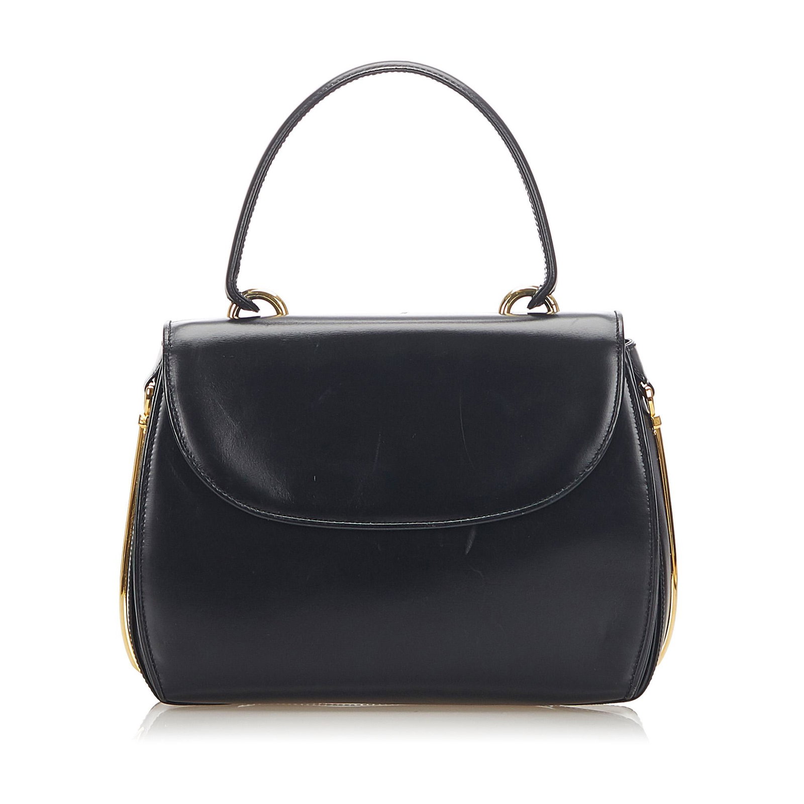 Authentic Gucci Leather Handbag: This item qualifies for FREE DOMESTIC SHIPPING to customers in the USA This handbag features a leather body a rolled leather top handle a front flap with a gold-tone twist lock closure and interior zi