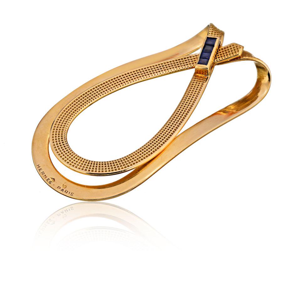 Authentic Hermes 18K Yellow Gold Money Clip Jewelry: This item qualifies for FREE DOMESTIC SHIPPING to customers in the USA Type: Money Clips Metal: 18K Yellow Gold Grams: 14.6 Measurements: L: 2.2 inches Condition: Excellent. Signed By: Hermes Paris Br